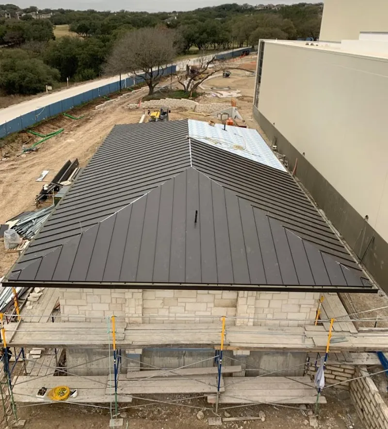Metal roof new construction with scaffolding in Litchfield